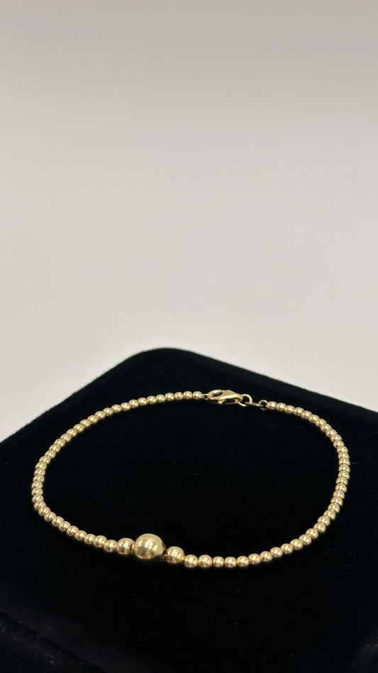 Pulso de oro 10k tejido bolitas